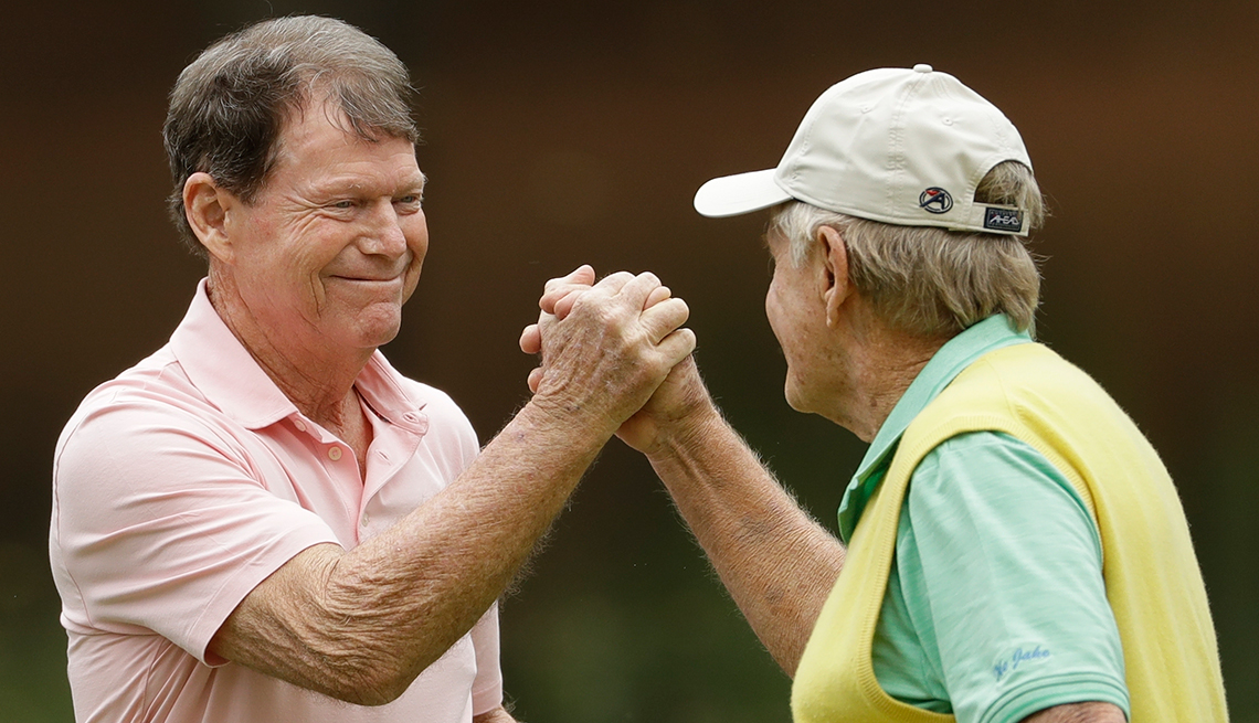 Tom Watson, left, and Jack Nicklaus shake hands 