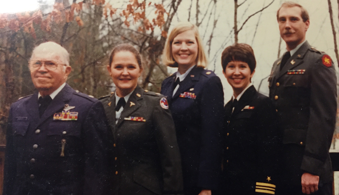 Leon Burgess, with, from left, daughters Cindy, Laura and Melody in 1996. Burgess served in the Air Force; his daughters, in the Army, Air Force and Navy, respectively.