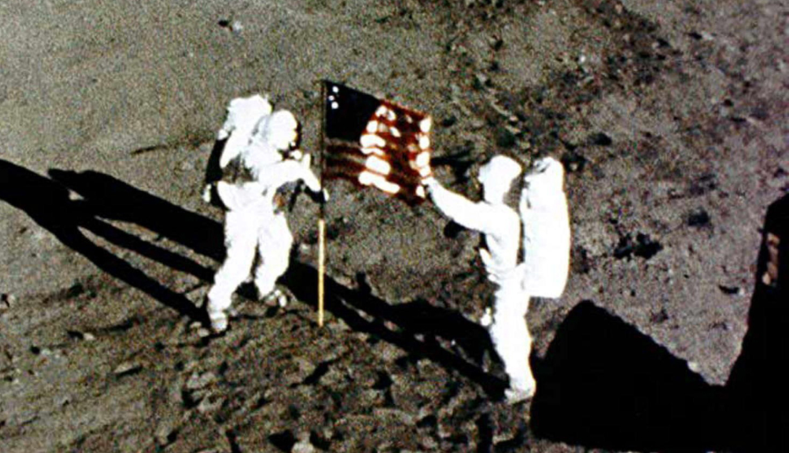 item 5 of Gallery image - Neil Armstrong and Buzz Aldrin raise the American Flag on the Moon