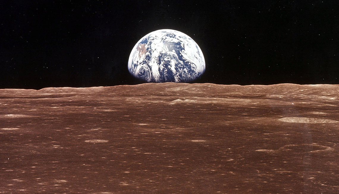 item 1 of Gallery image - A view of Earth has it appears over the lunar horizon