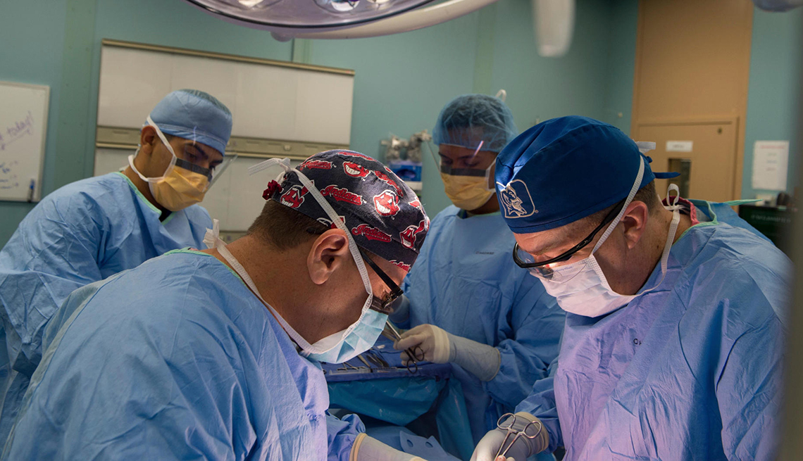 item 5 of Gallery image - Four doctors are working during a surgery