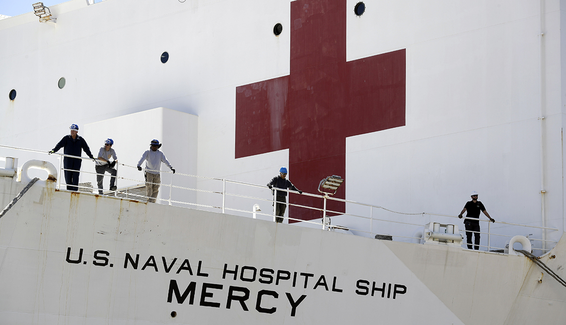 closeup of hospital ship with the identifier name mercy showing on its side