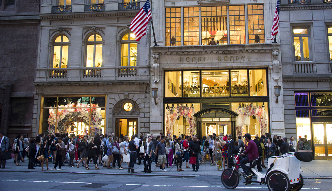 item 15 of Gallery image - evening street view of the front of a henri bendel retail store with shoppers lined up outside from two thousand eleven