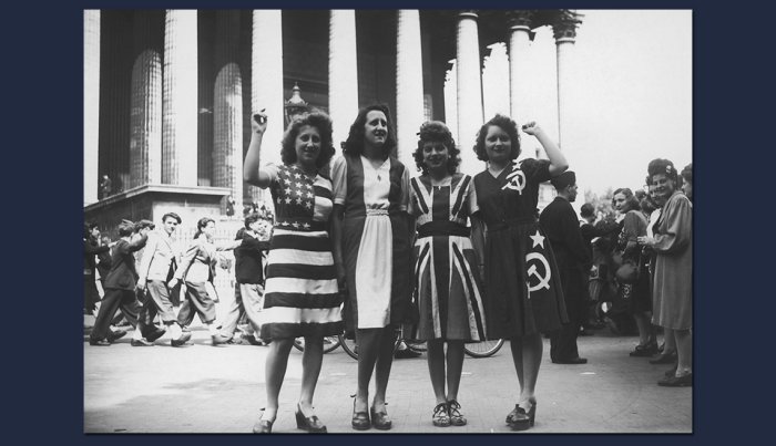 item 7 of Gallery image four women pose in dresses made to look like the flags of four allied countries at the end of world war two