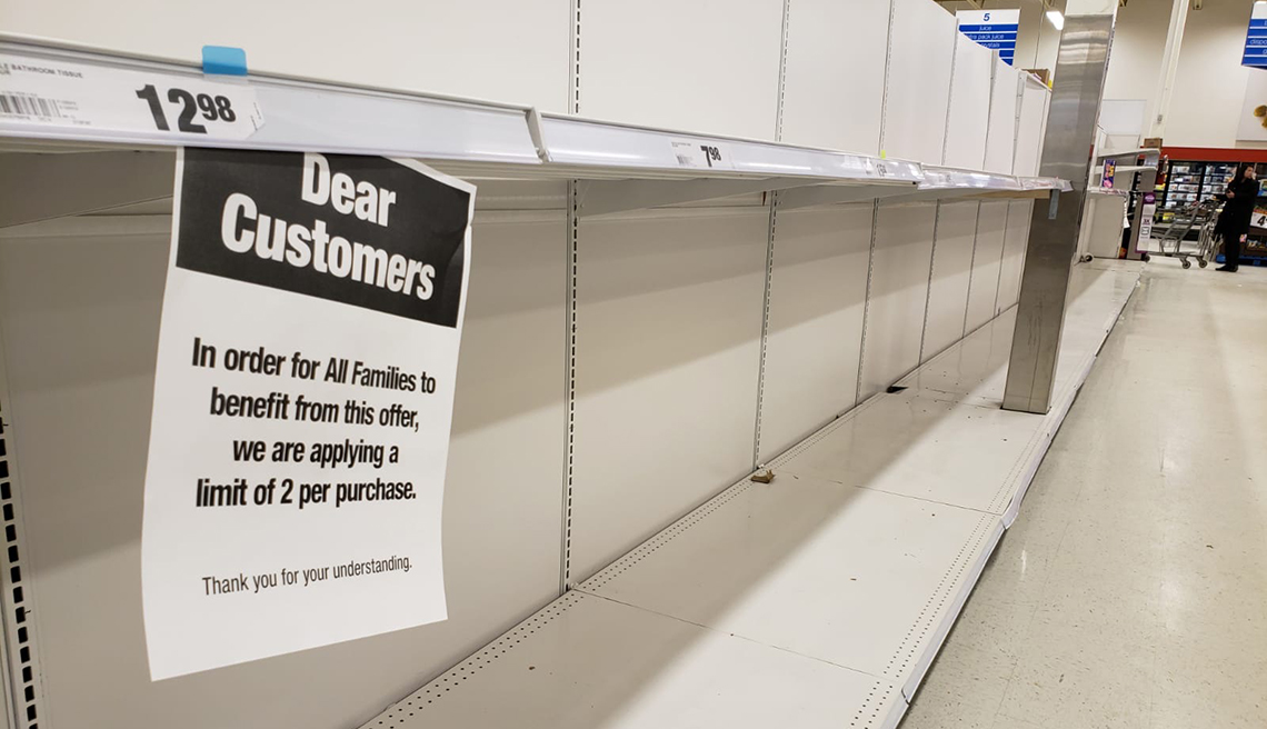 item 2 of Gallery image - empty shelves in a store with a sign imposing limits on purchases