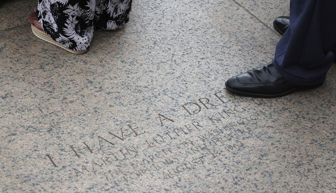 item 9 of Gallery image - A person stands at the martin luther king junior memorial
