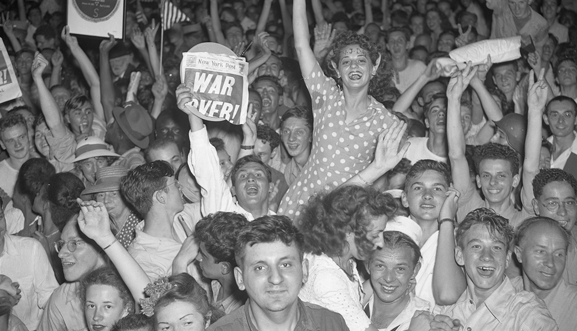 item 5 of Gallery image - crowd of jubilant people celebrating war is over on v j day at the end of world war two