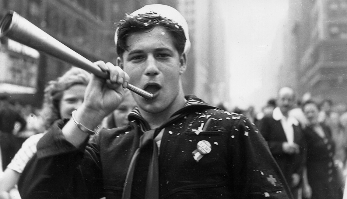 item 6 of Gallery image - a u s sailor blows a horn during a vj day celebration photo