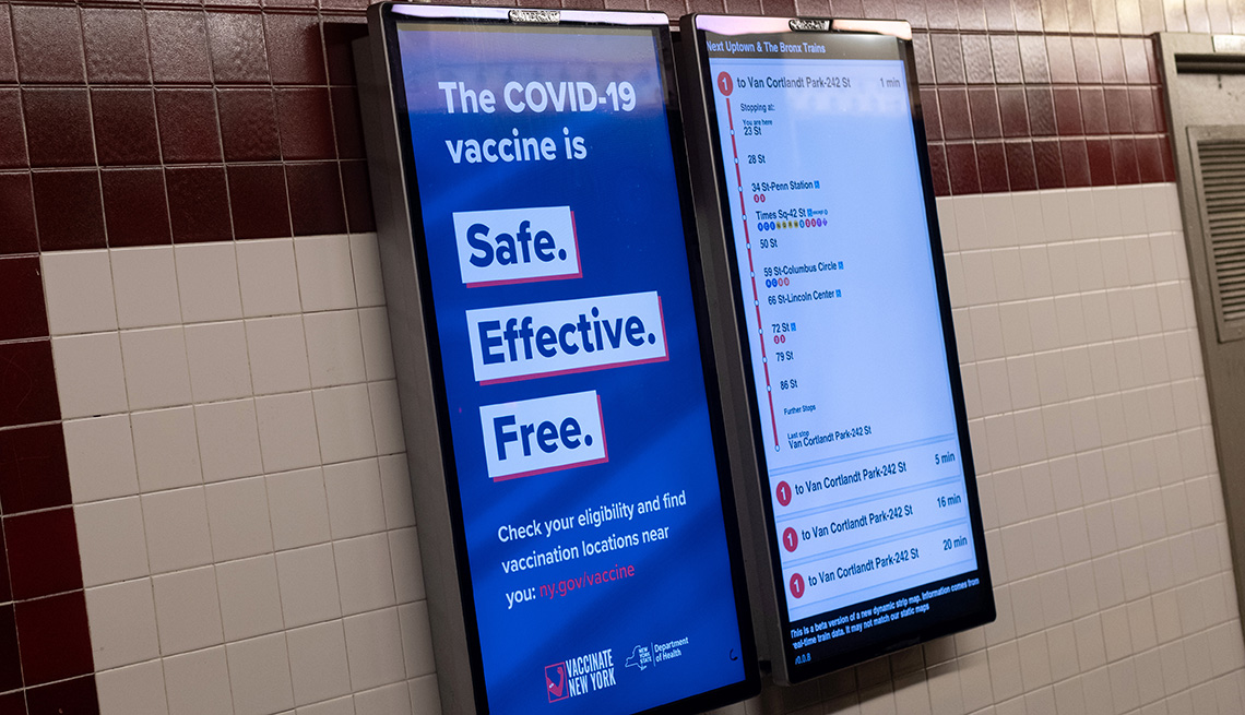 item 4 of Gallery image - a sign in the new york subway communicating that the covid nineteen vaccine is safe effective and free