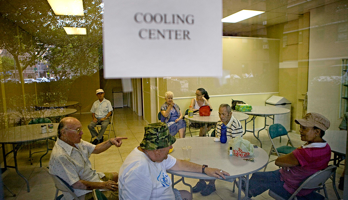seniors sit inside a cooling center