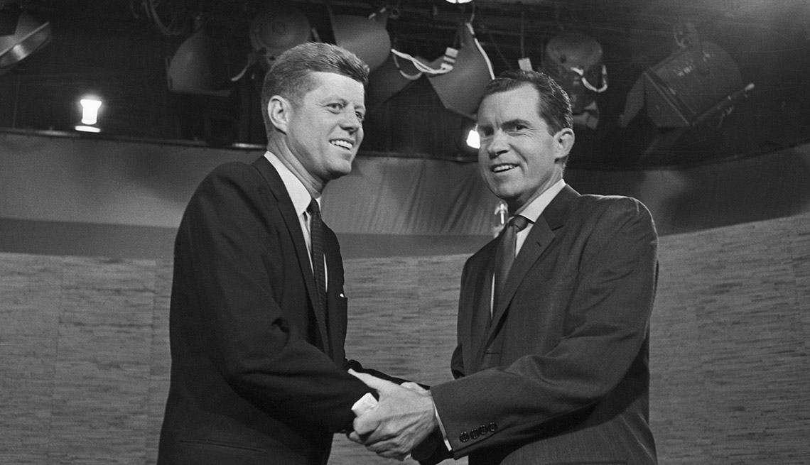 Presidential candidates John F. Kennedy and Richard Nixon shake hands after their televised debate of October 7, 1960. 