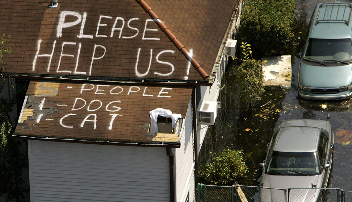 item 1 of Gallery image - a plea for help written on the roof of a house flooded in the aftermath of hurricane katrina