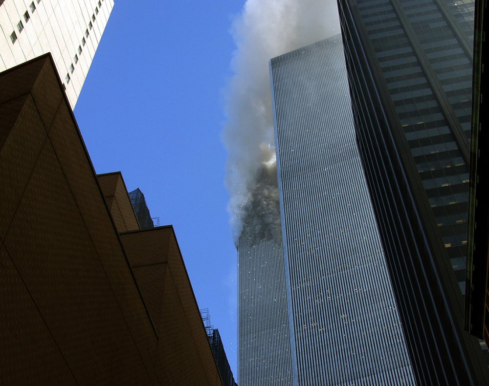people jumping from world trade center holding hands