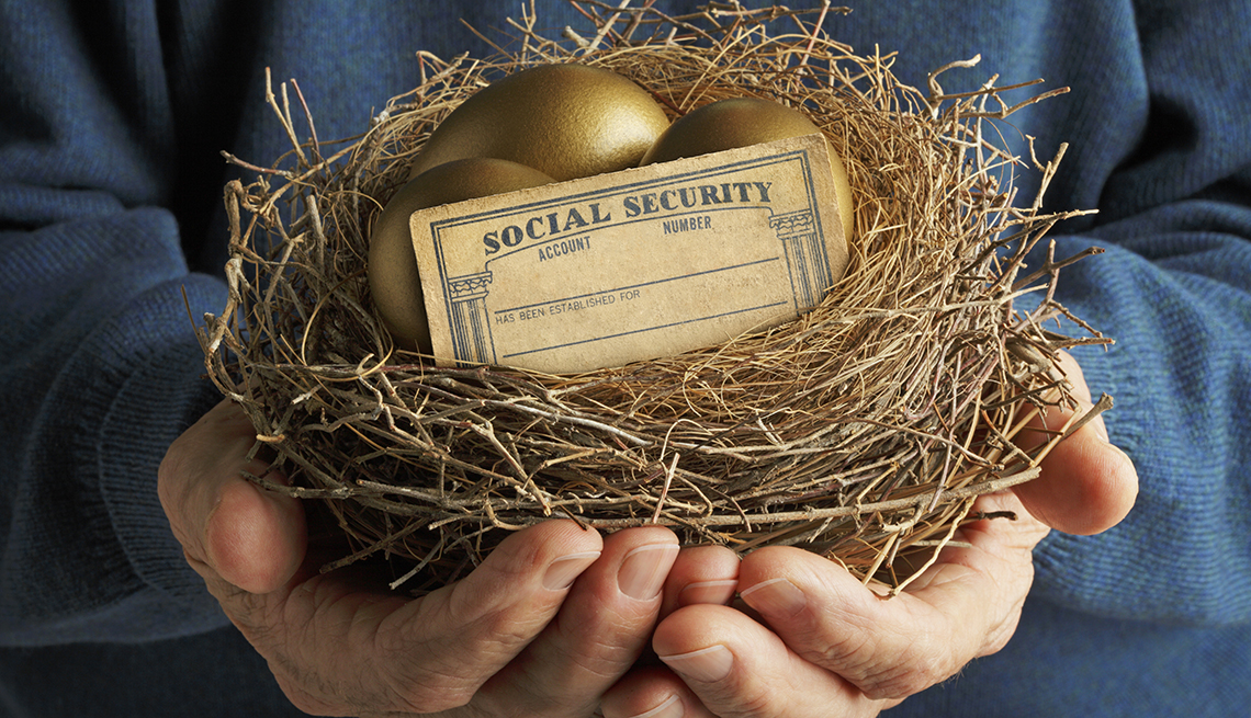 Person holding a nest with golden eggs and a Social Security card.