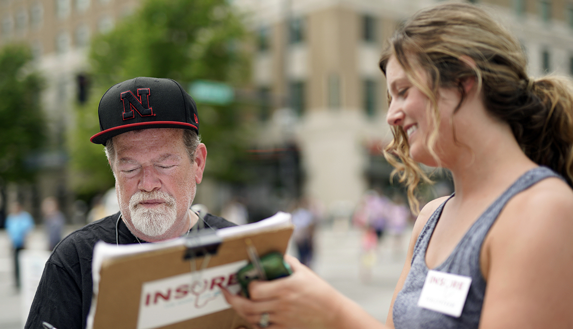 Man signs a petition to expand Medicaid in Nebraska