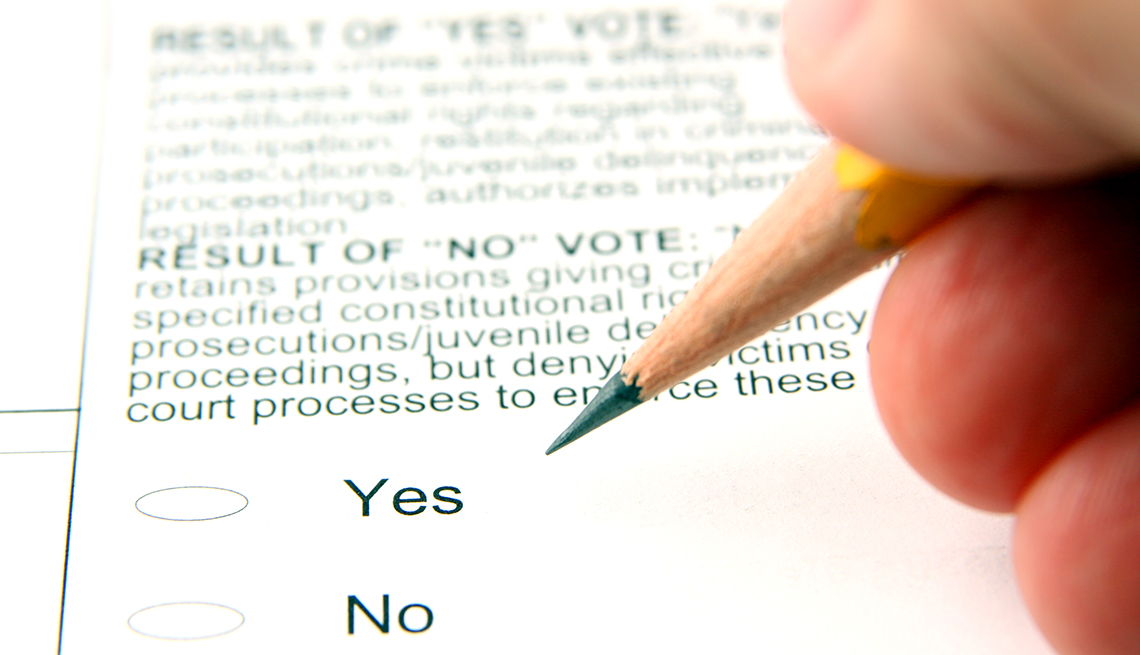 A person filling out a ballot