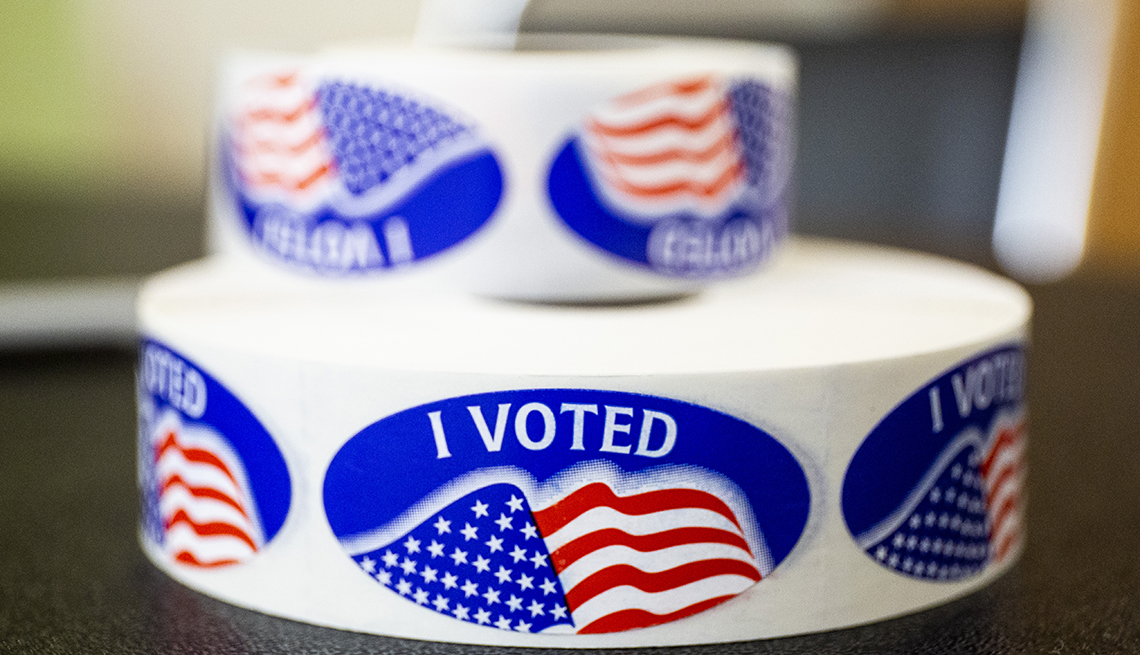 Blue stickers with the word I voted on them