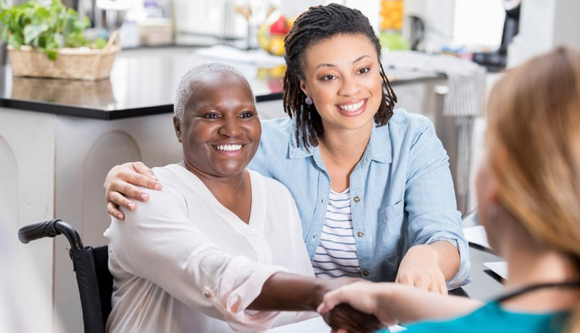 Family Caregiver with Patient and Nurse