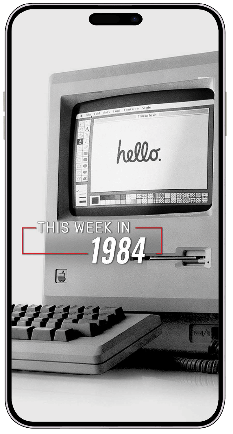 Photo of a smartphone showing a 1984 Apple computer on its screen