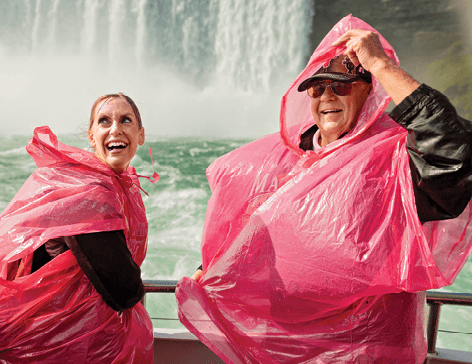 Photo of a man and woman in ponchos at Niagara Falls