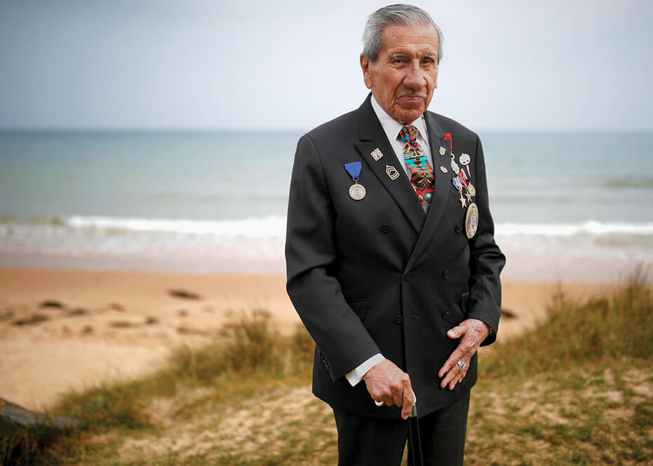 Portrait photograph of Charles Norman Shay on a beach in Normandy in 2019.