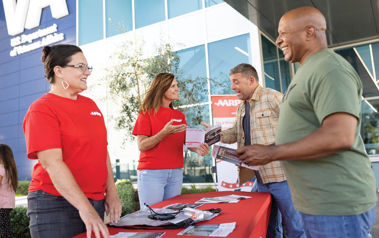 Photo of AARP volunteers interacting with community members