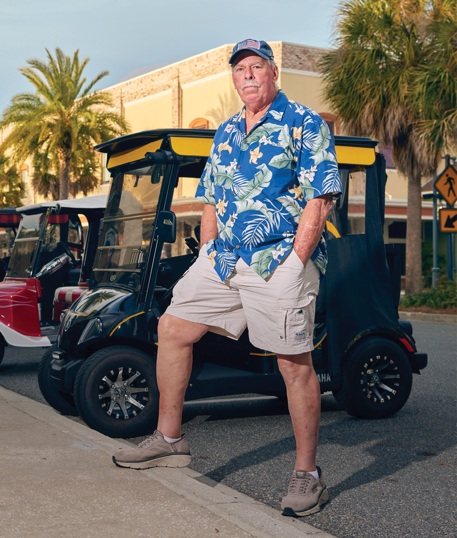 Portrait of Bill Eder wearing shorts and a Hawaiian shirt&nbsp;
