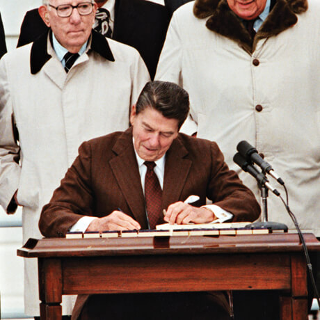 Photo of Ronald Reagan signing a bill