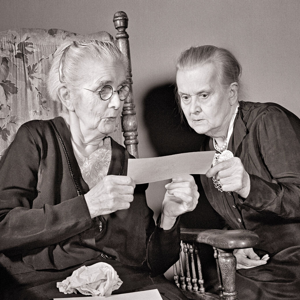 Historical photo of elderly woman receiving Social Security check