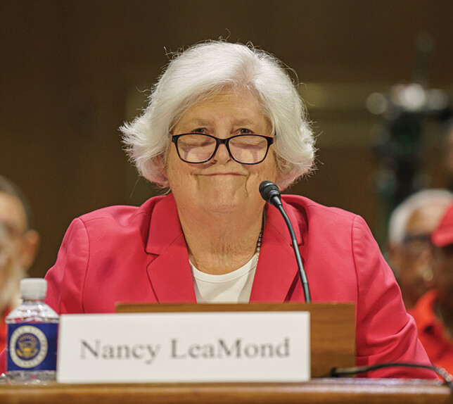 Image of Nancy LeaMond in a red blazer smiling.