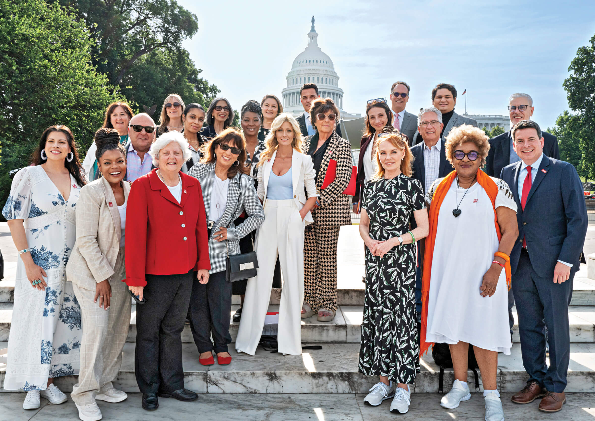 Group photo of AARP volunteers with television and entertainment stars