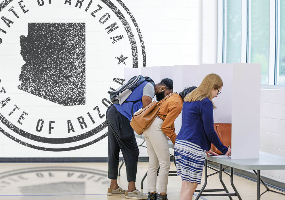 Photo of three voters casting their ballots