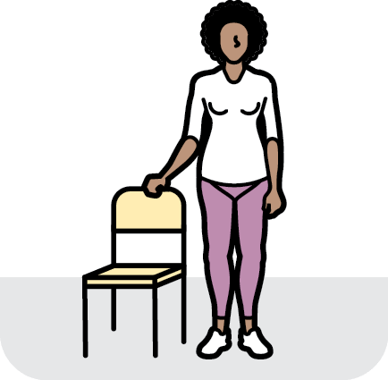 Icon of a woman standing next to a chair with one arm on the back of the chair