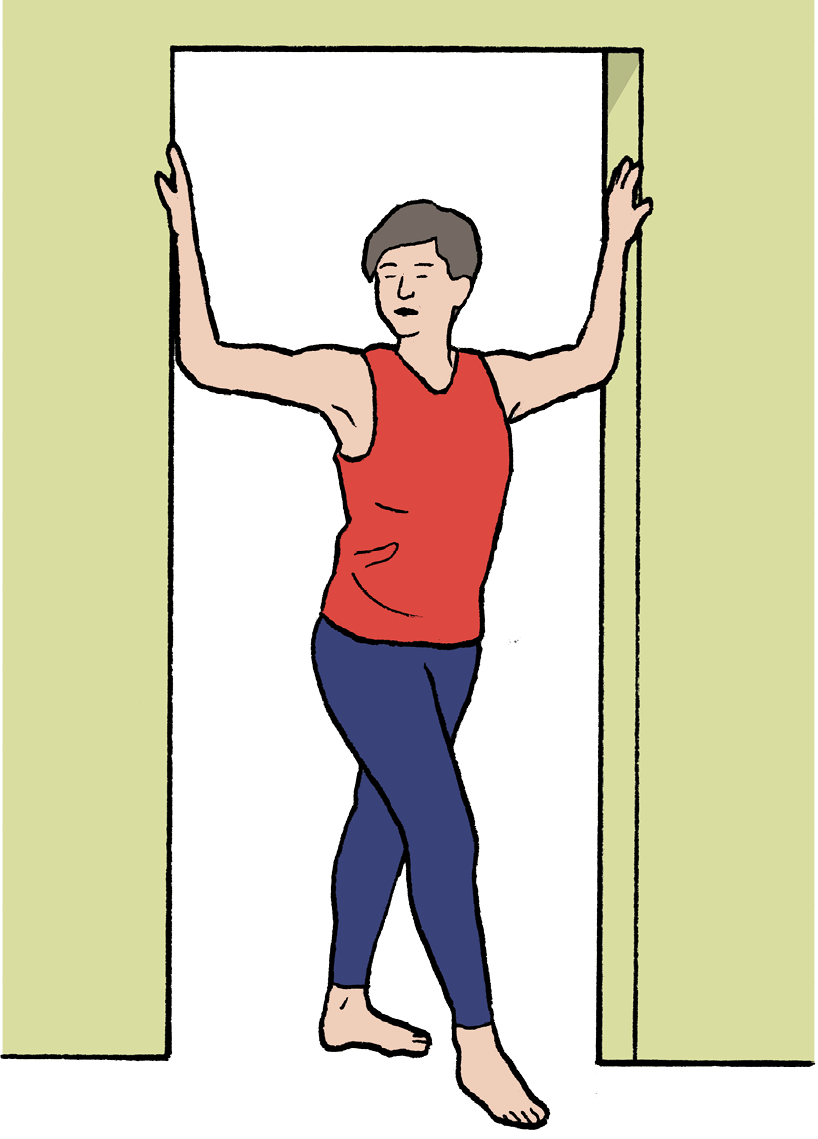 A woman standing in the middle of a doorframe with her hands against the sides