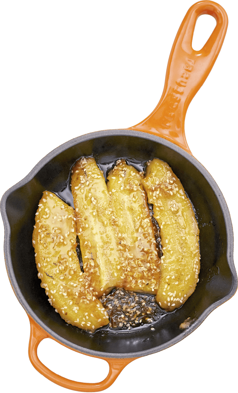 Photo of panfried bananas in a skillet