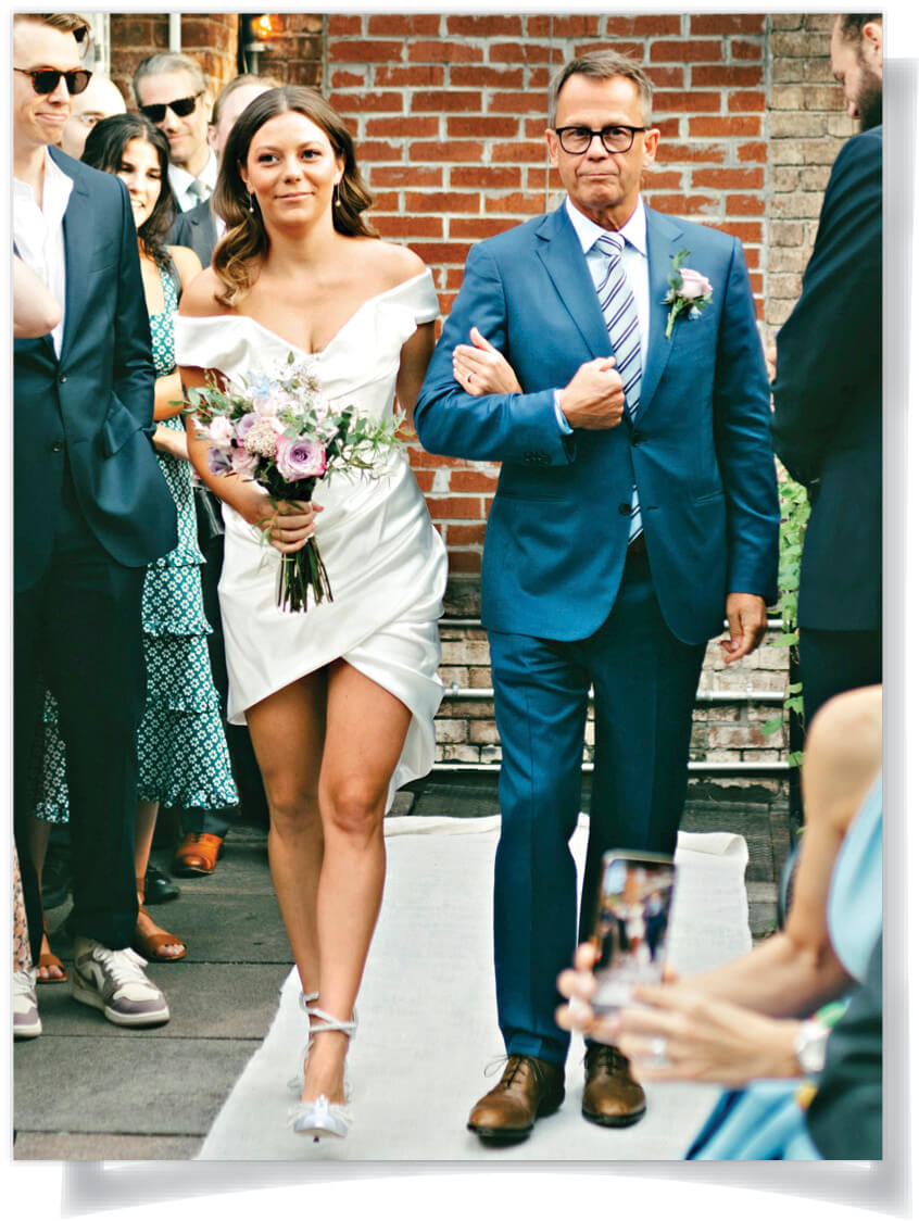 Photo of Steve Perrine walking his daughter down the aisle