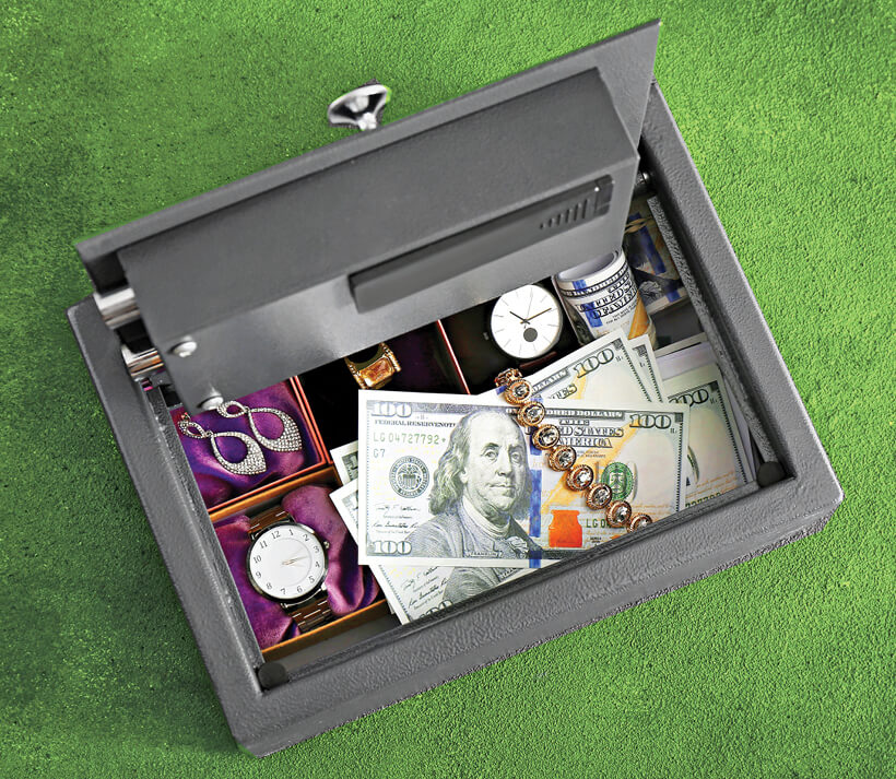 Photo of an open home safe filled with money and jewelry