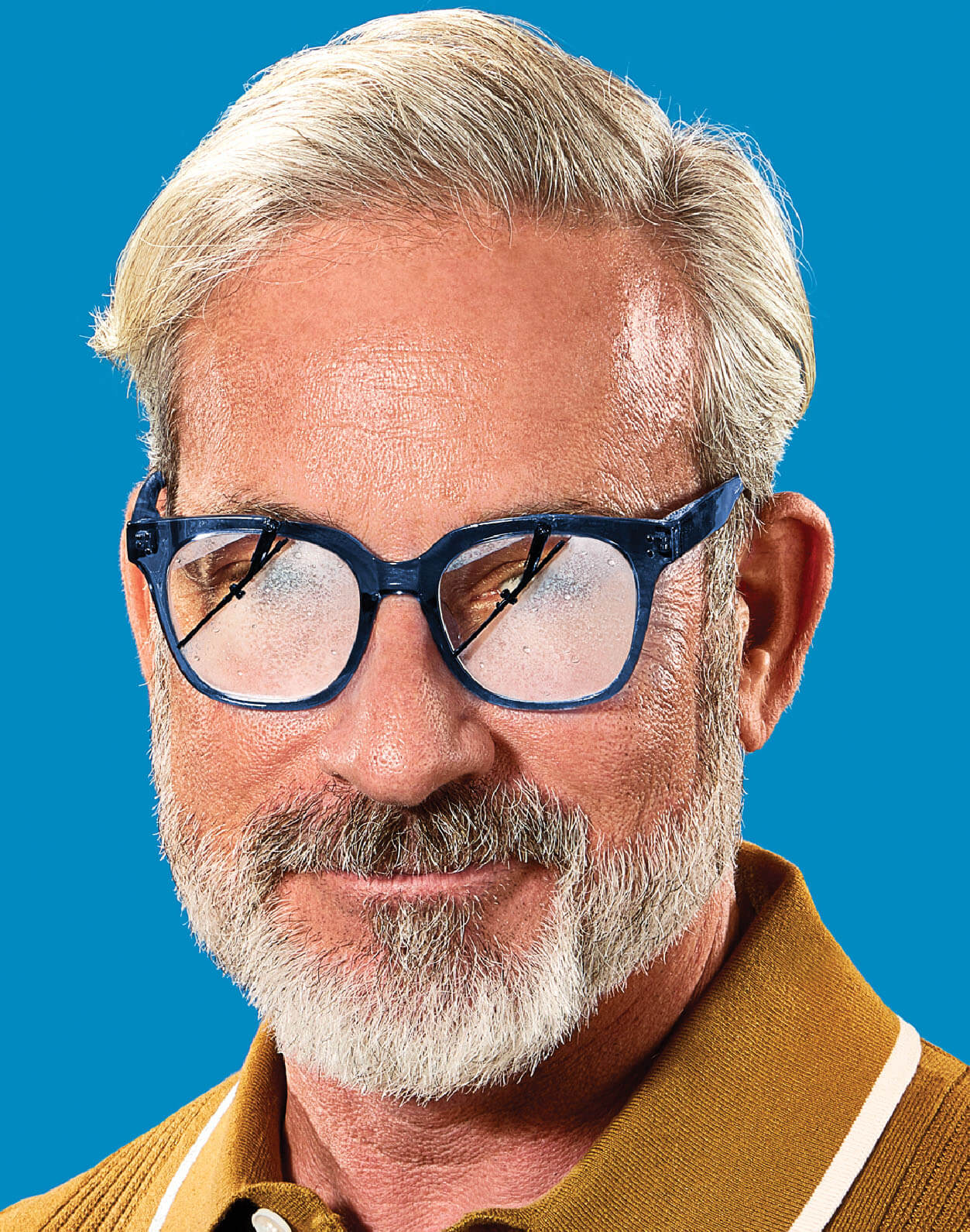 Photo illustration of an older man wearing glasses, they are fogged and have mini windshield wipers starting to clean them