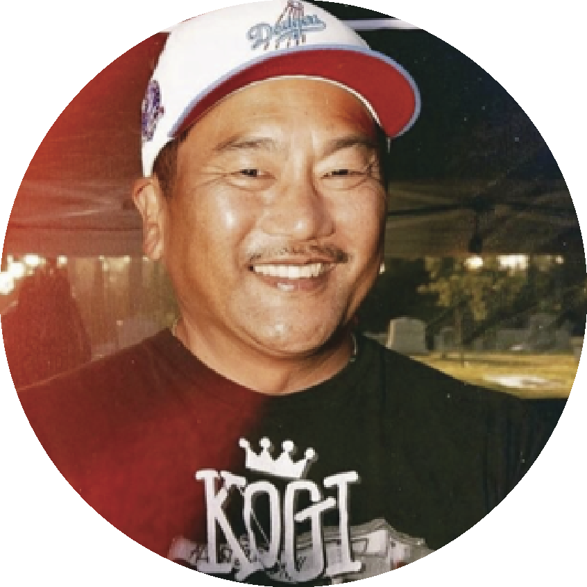 Portrait of Chef Roy Choi wearing a Kogi t-shirt and a baseball cap