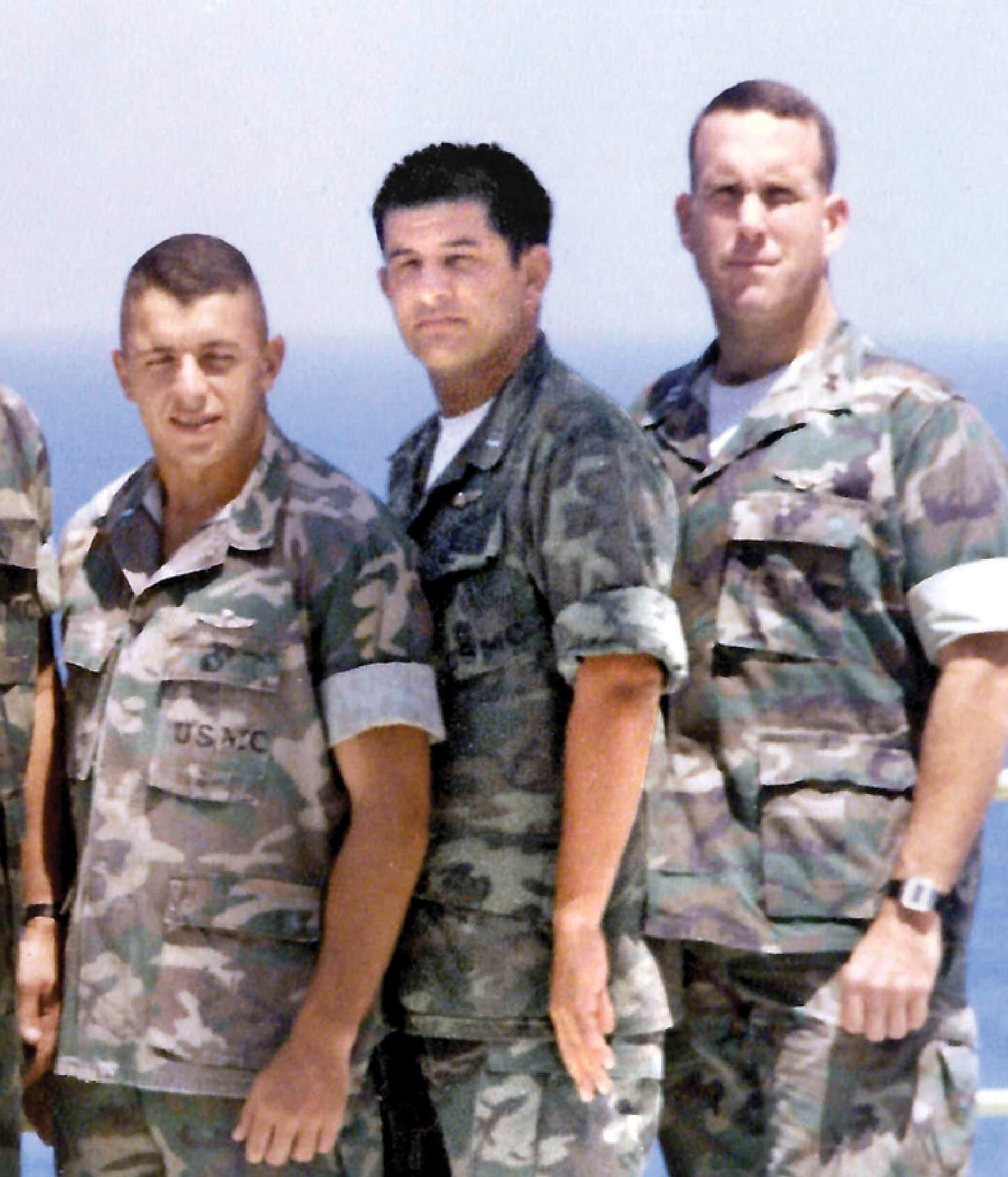 Photograph of Hank Donigan, Patrick Giguere and another soldier aboard the USS Nashville in July 1982