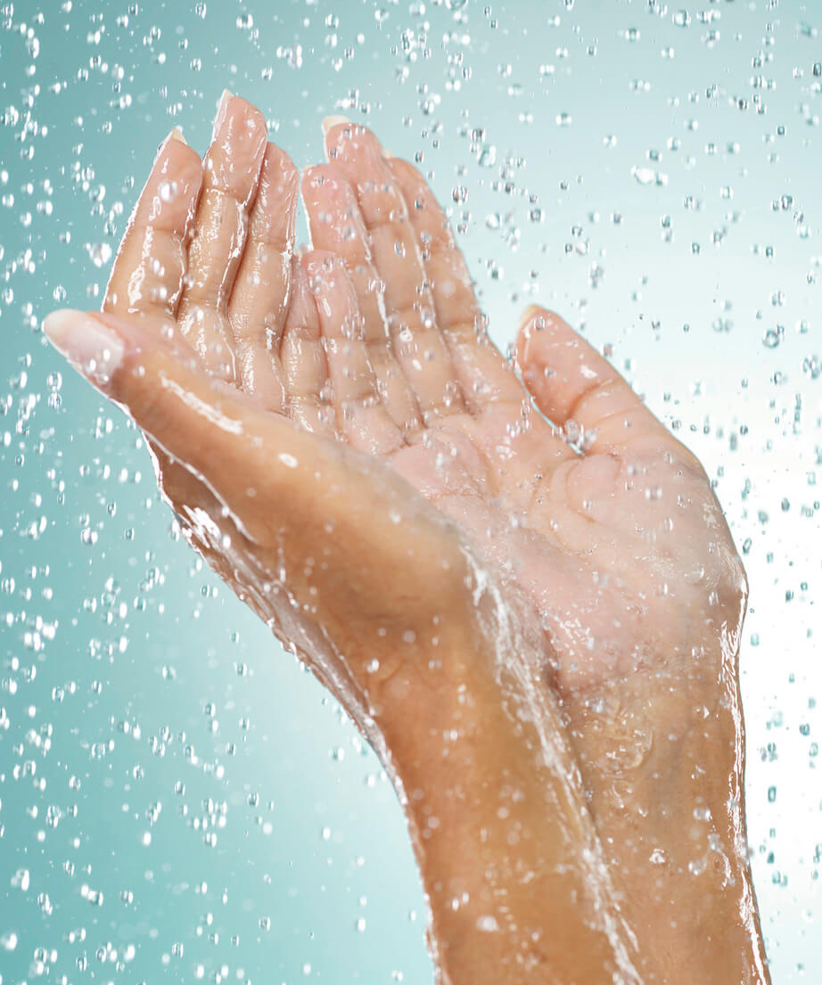 Photograph of hands in the shower
