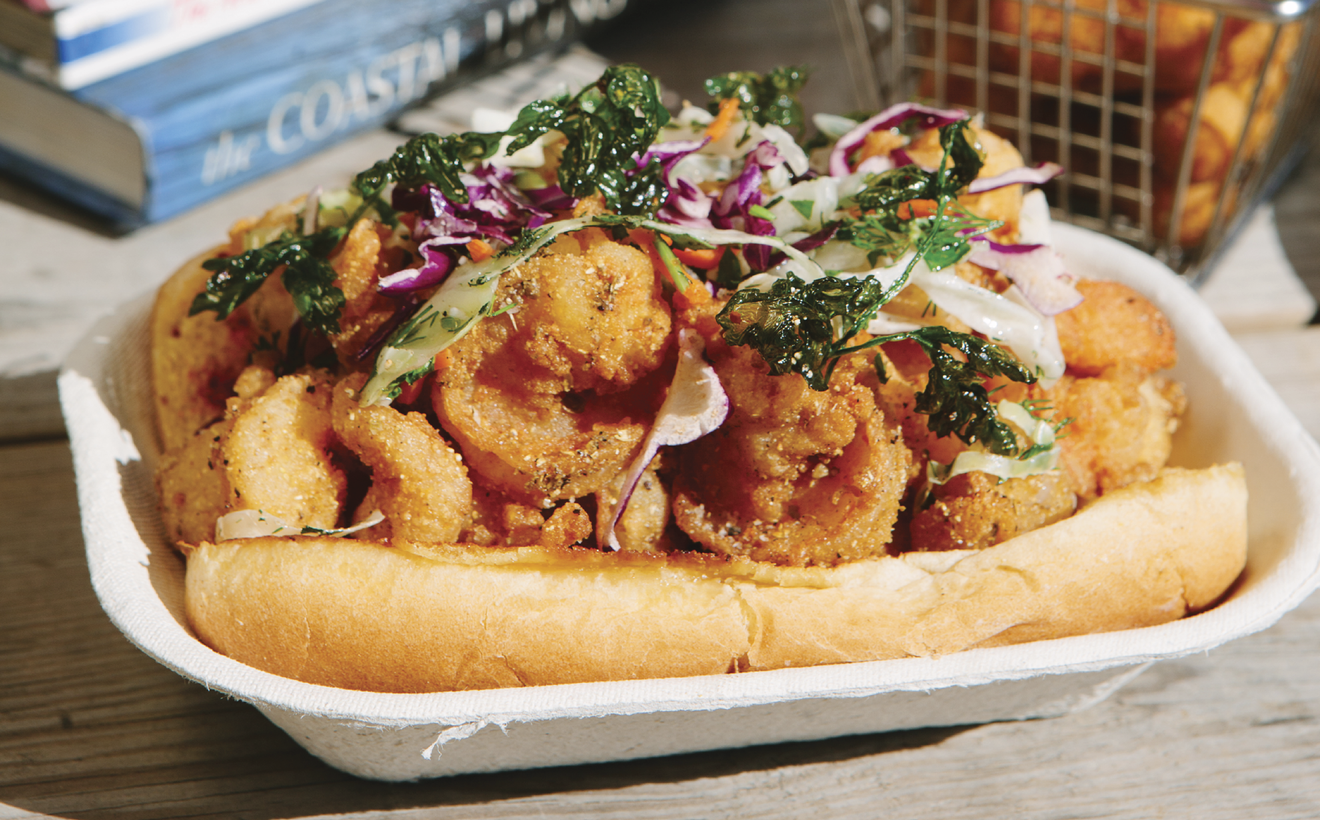 A paper takeout container with the Saltbox Seafood Joint’s shrimp roll 