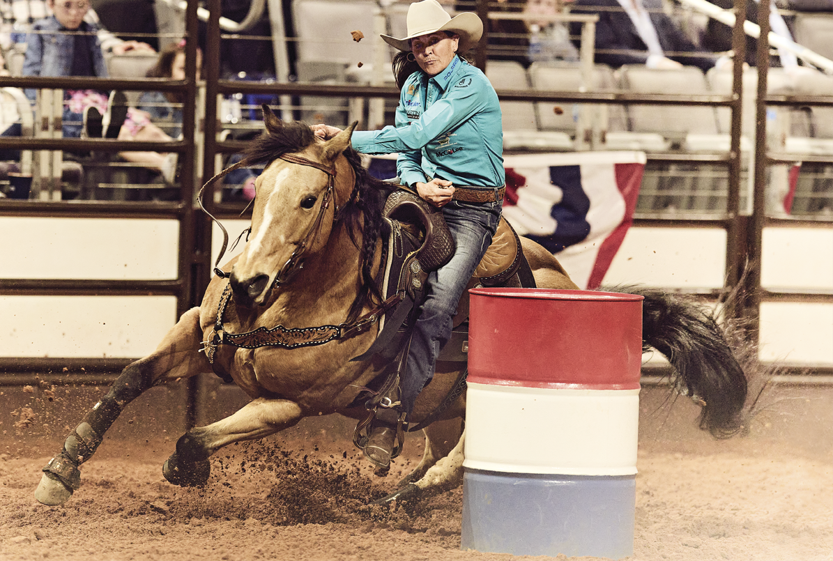 Lisa Lockhart and her horse Rosa competing in barrel racing in Fort Worth, Texas. 