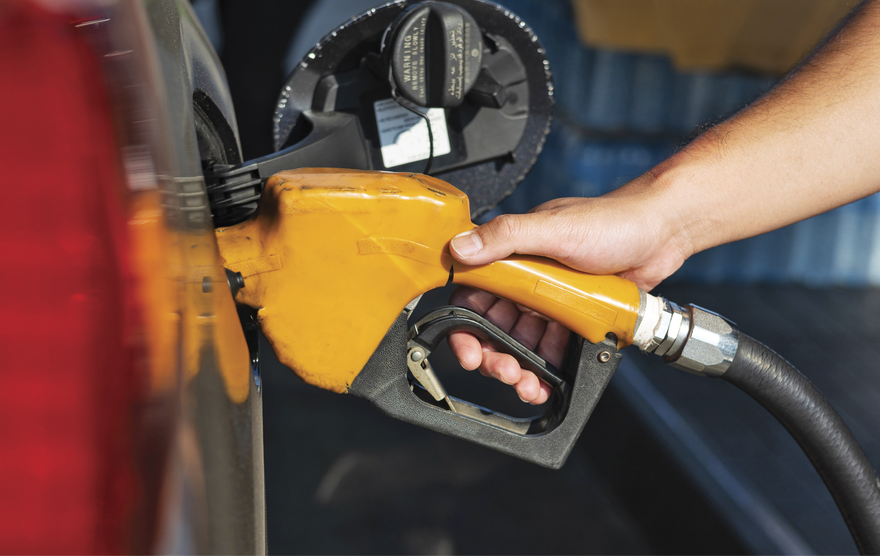 A person filling gas