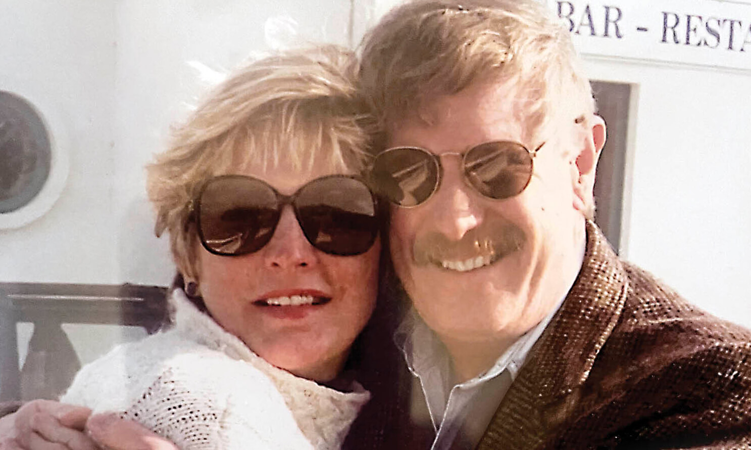 Image of Mary Helen and her late husband Bill Photograph of Jack McBrayer wearing a blue shirt and smiling