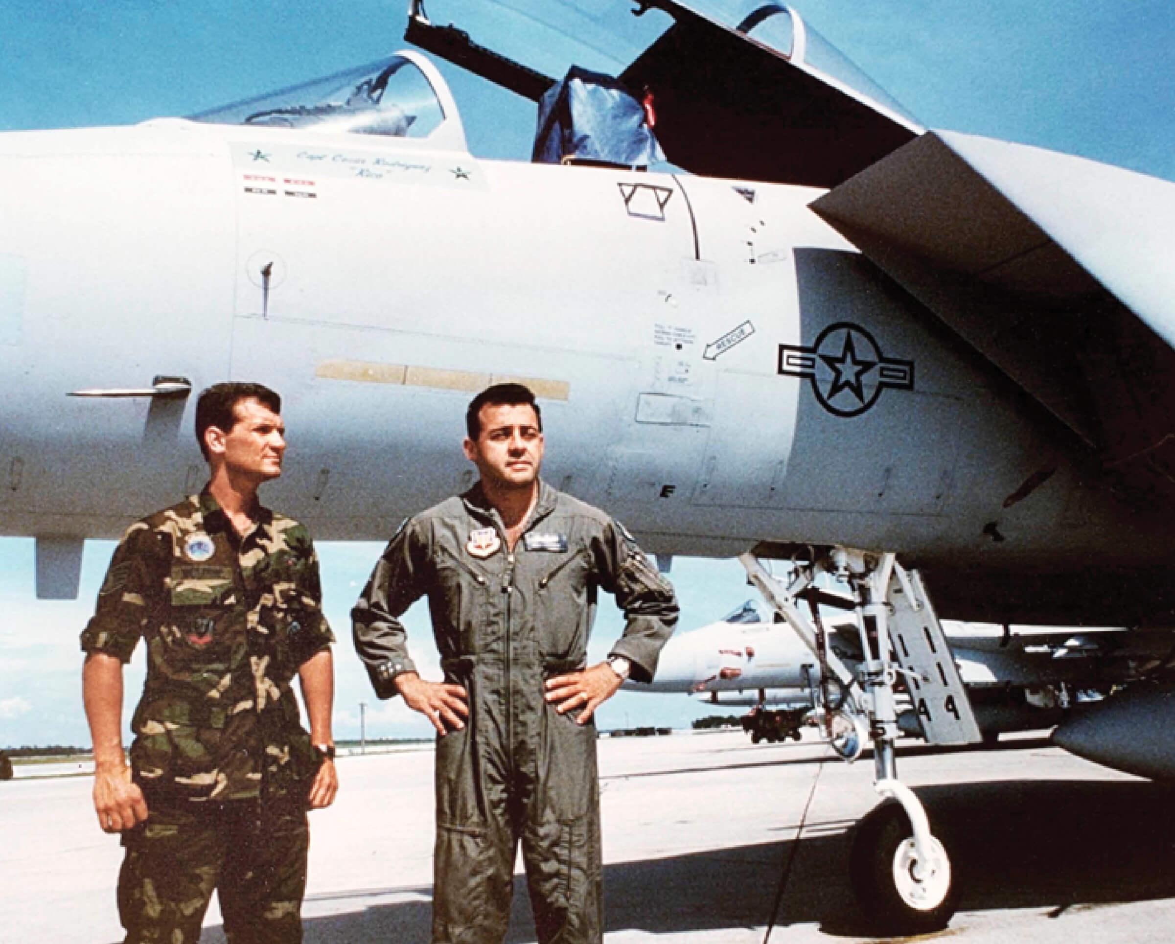 Davis Westrup and Cesar Rodriguez standing in front of a plane in 1991 during the Gulf War