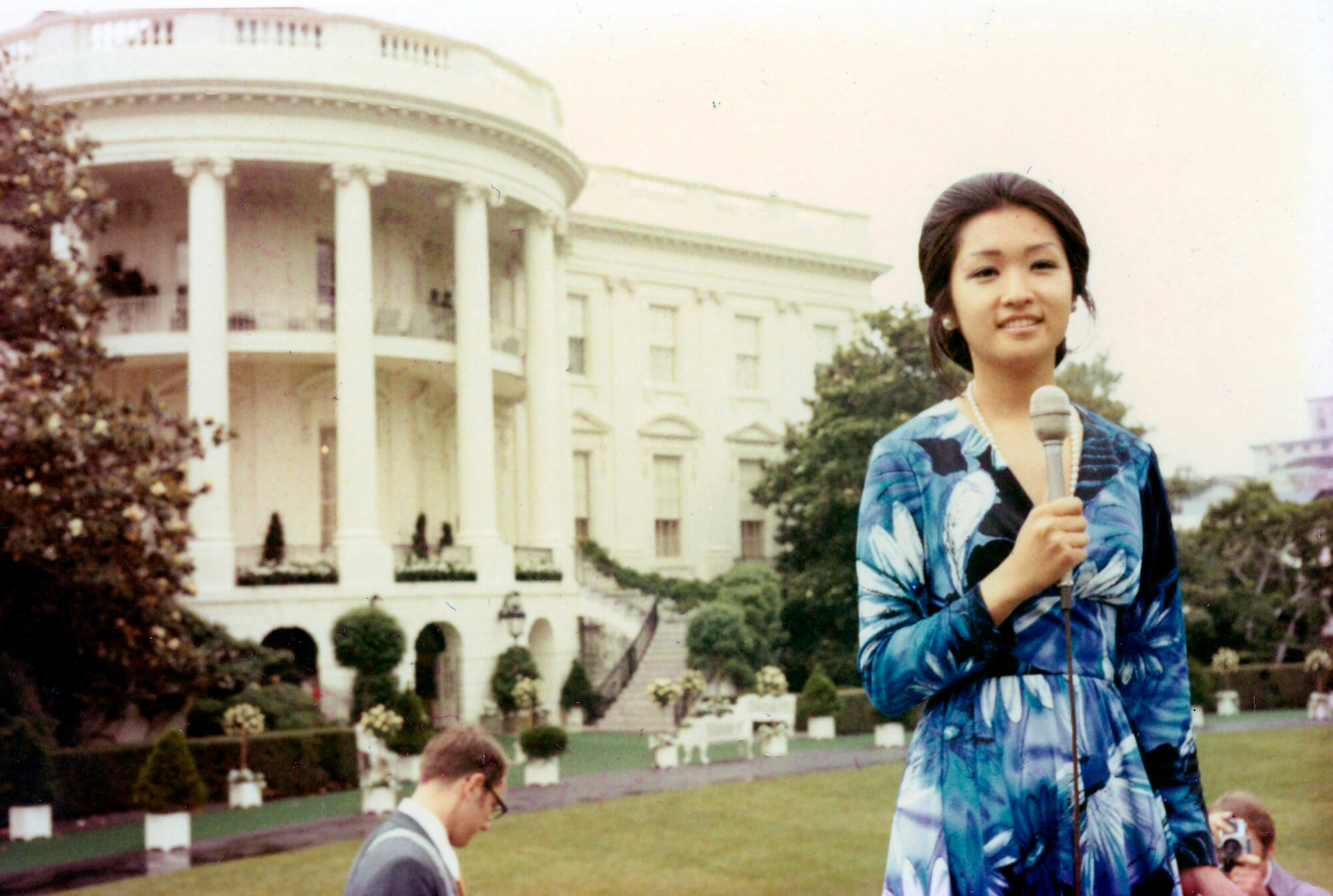 Chung reporting in front of the White House, 1971