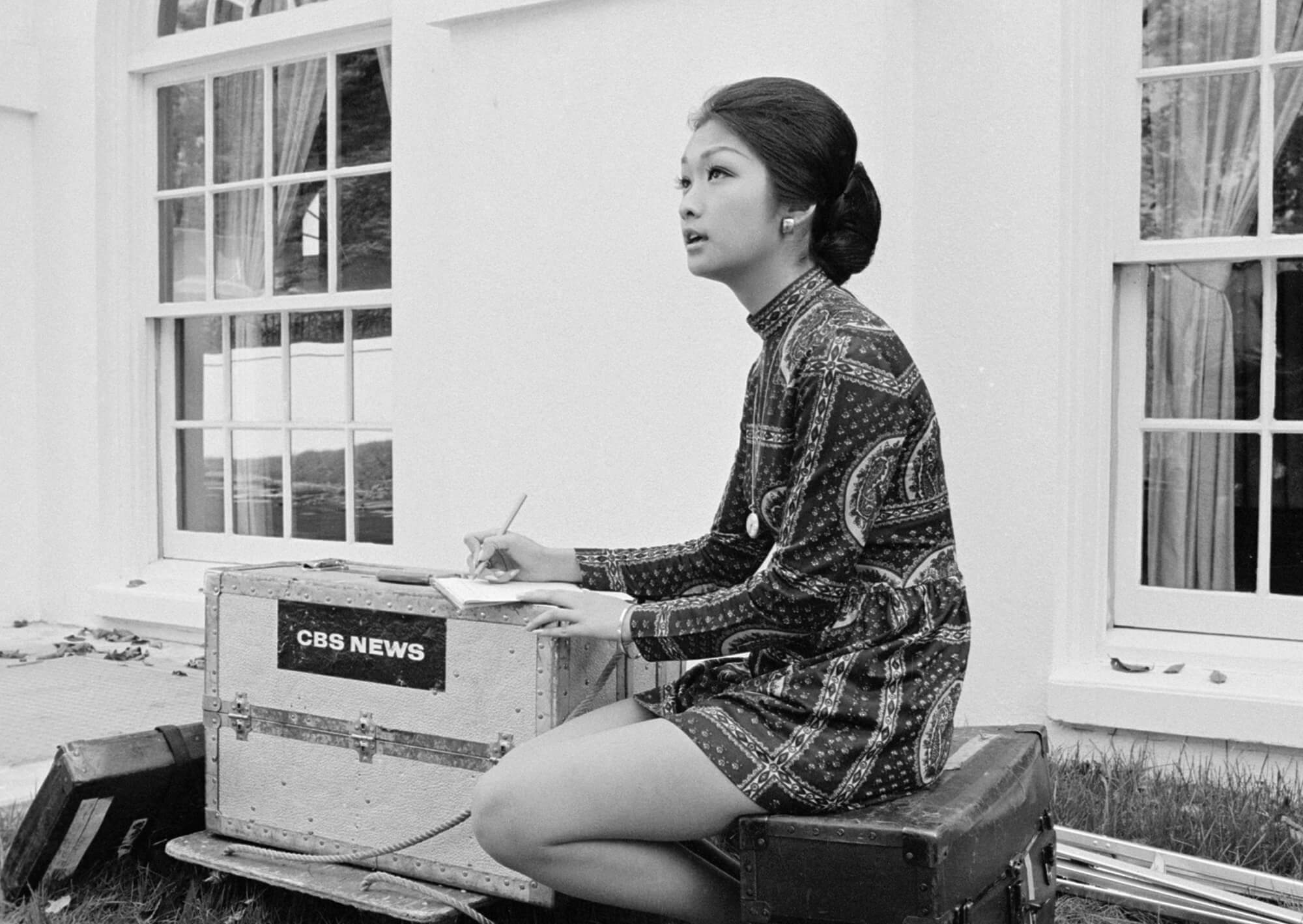 Chung writing on location, 1972.