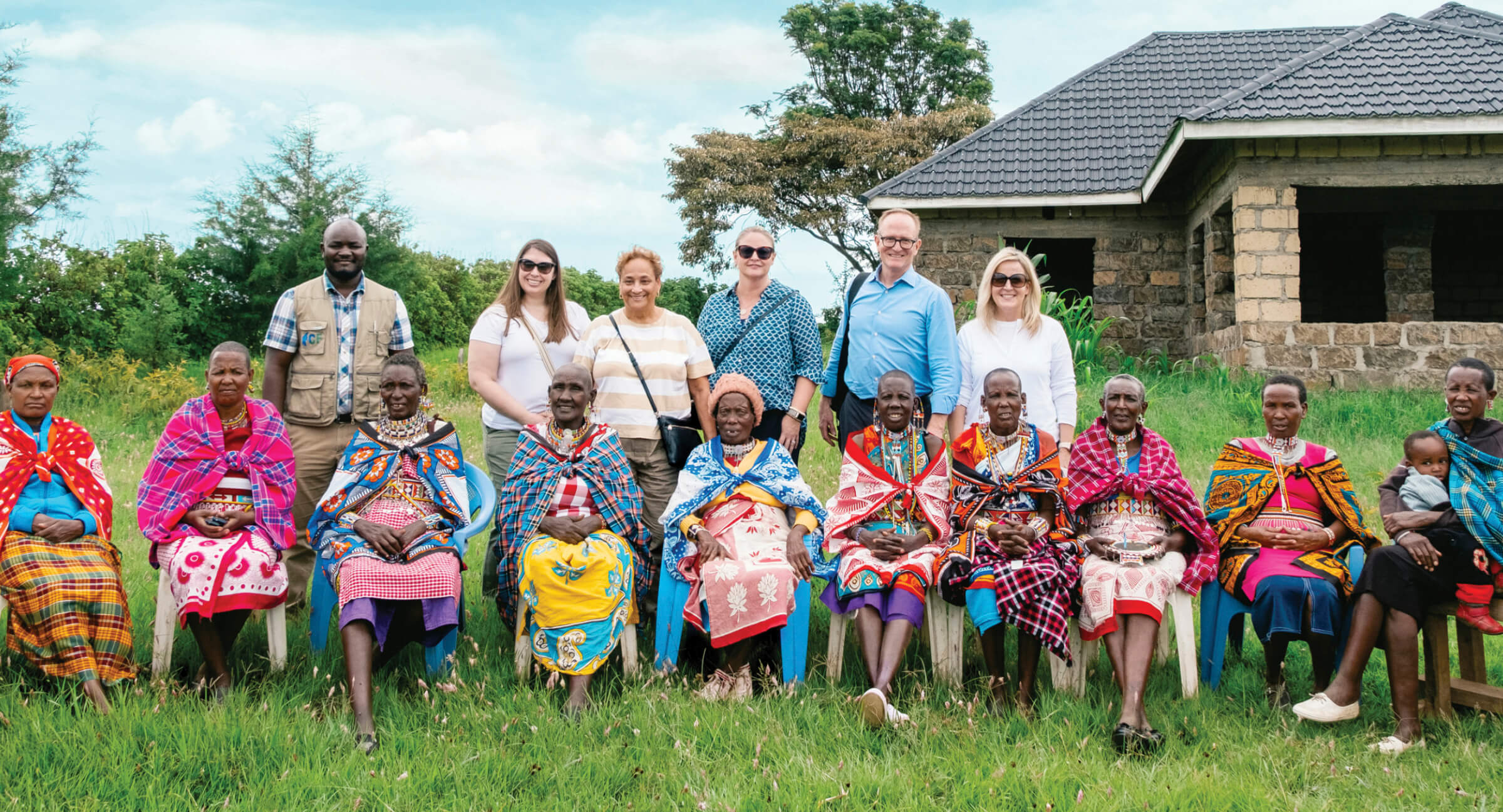 Photo of AARP CEO Jo Ann Jenkins, EVP Debra Whitman (standing, third and fourth from left) and team meet with a Kenyan Older Persons Association.