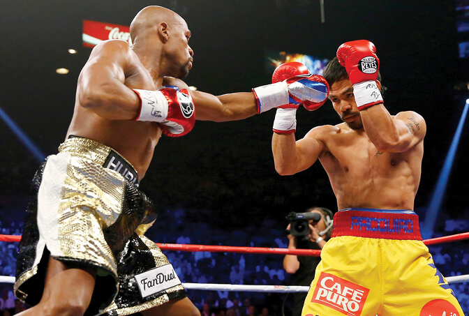 Photo of Floyd Mayweather Jr. and Manny Pacquiao boxing